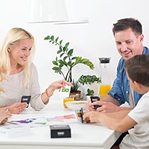 family playing an educational card game board game learning geography with flags and a world map